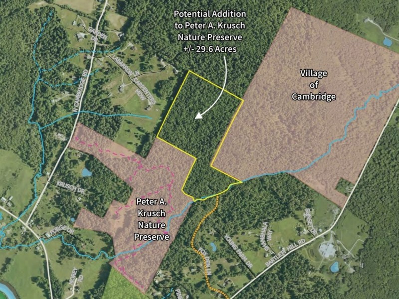 Aerial map showing Peter A. Krusch Nature Preserve, a potential 29.6-acre addition, village boundary, property lines, roads, and surrounding wooded and residential areas.