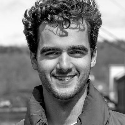 A black and white photo of a man's face.