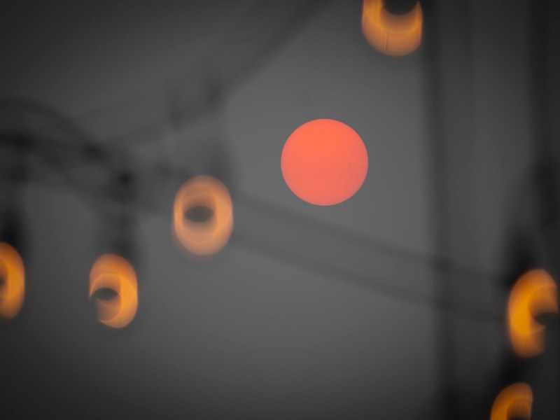 a blurry photo of a red light in the dark.