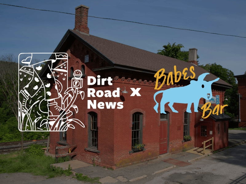 A red brick building with a chimney and two entrances features graphic logos for "Dirt Road News" and "Babes Bar" overlaid on the image.